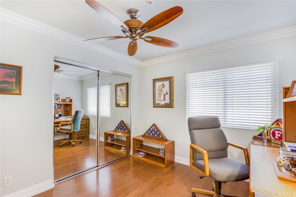 30 Santa Clara San Clemente, CA 92672 - Photo 23 of 31 Downstairs Bedroom/office with Double Doors, ceiling fan and wood floors.