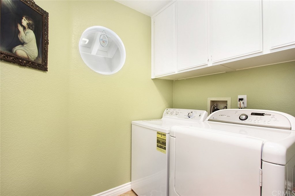 30 Santa Clara San Clemente, CA 92672 - Photo 25 of 31 Large laundry room has lots of storage.