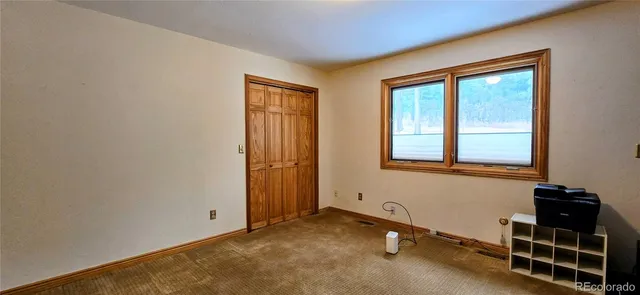 a room with gym equipment and a window