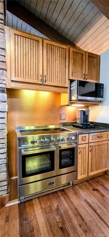 a view of kitchen with stove top oven