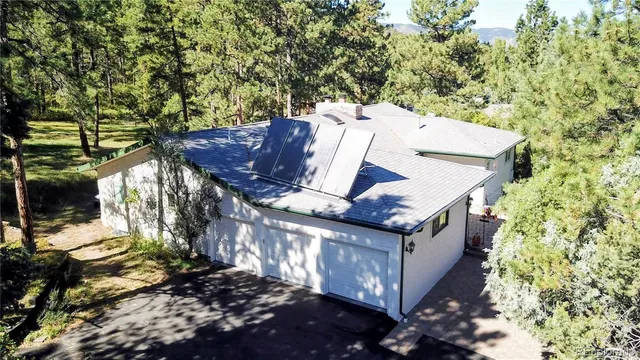 a view of a house with a tree