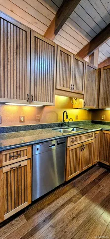 an empty room with wooden floor