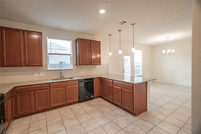 a bathroom with a granite countertop sink a toilet and a mirror