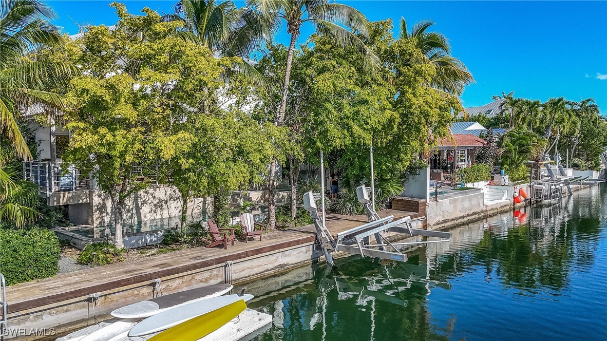 4 Coconut Drive Key West, FL 33040 - Photo 12 of 47 a view of a lake with a house and a park