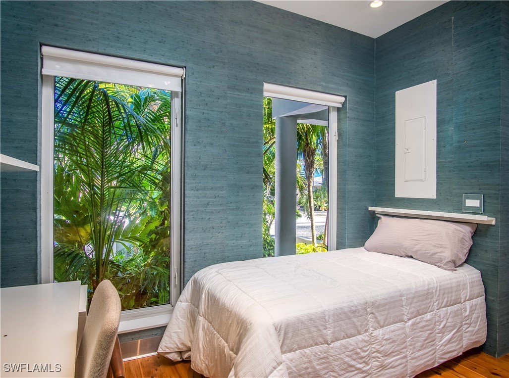 4 Coconut Drive Key West, FL 33040 - Photo 22 of 47 a bedroom with a bed and a window