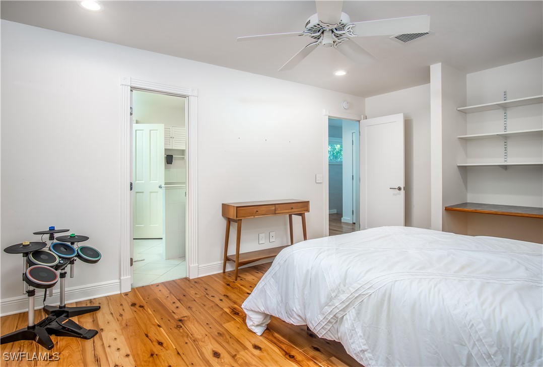 4 Coconut Drive Key West, FL 33040 - Photo 32 of 47 a bedroom with a bed and a chandelier