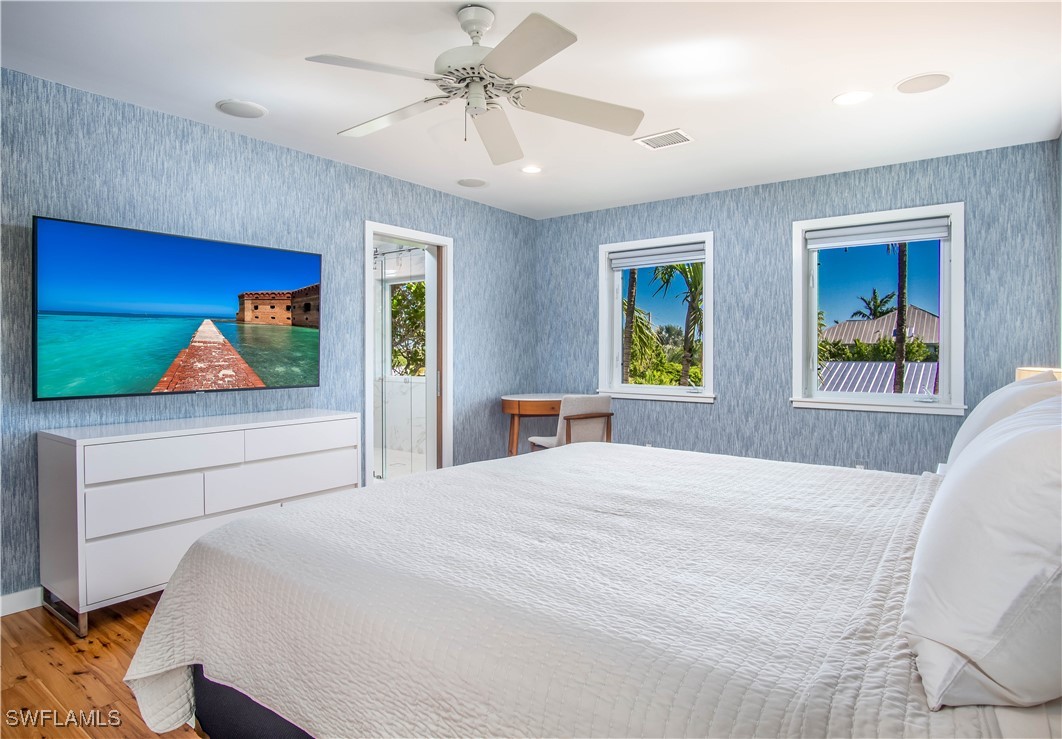 4 Coconut Drive Key West, FL 33040 - Photo 37 of 47 a bedroom with a bed and a painting on the wall