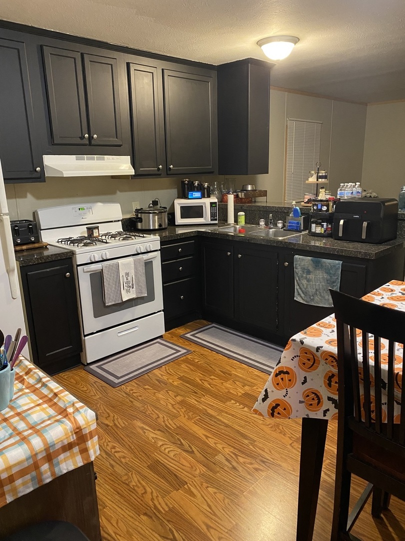 36 Cedar Street Minooka, IL 60447 - Photo 3 of 12 a kitchen with a sink and cabinets