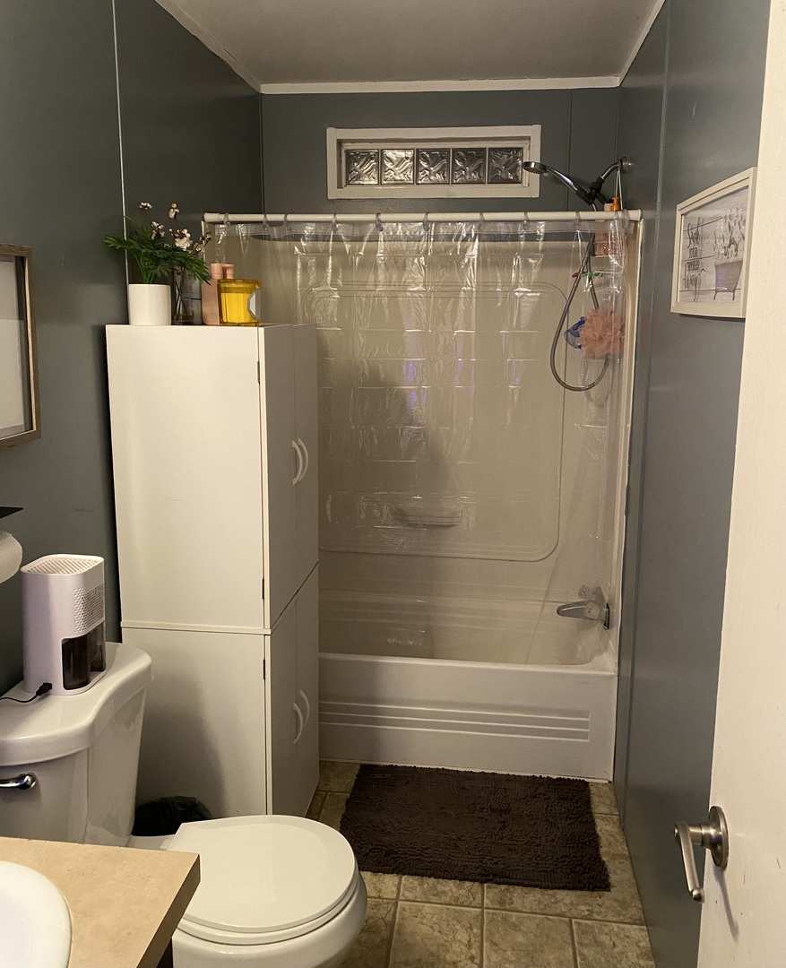 36 Cedar Street Minooka, IL 60447 - Photo 6 of 12 a bathroom with a toilet and a shower