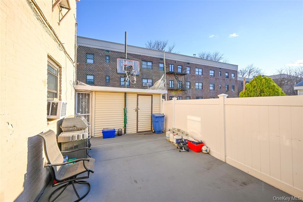 72-08 150th Street, Unit 199A Queens, NY 11367 - Photo 14 of 14 a living room with furniture and a window