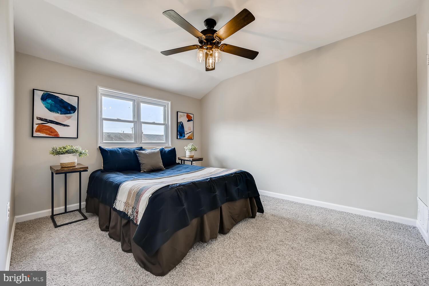 2720 Moorgate Road Baltimore, MD 21222 - Photo 14 of 28 a bed room with a bed and a ceiling fan