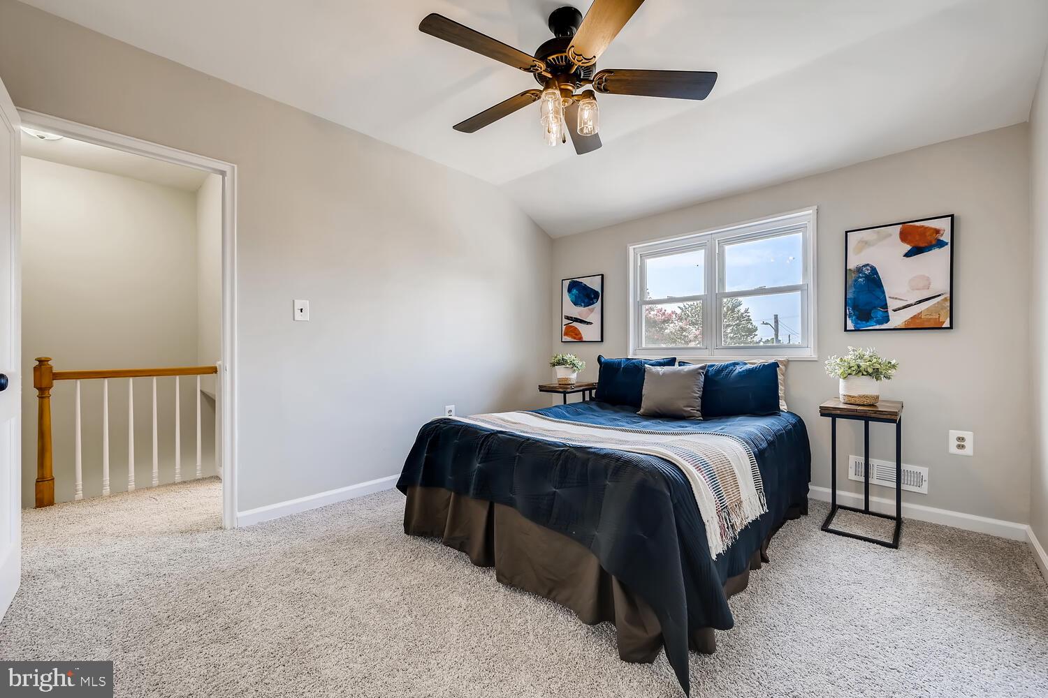 2720 Moorgate Road Baltimore, MD 21222 - Photo 15 of 28 a bed room with a bed and a ceiling fan