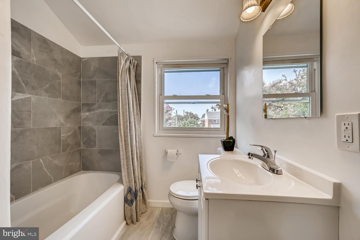 2720 Moorgate Road Baltimore, MD 21222 - Photo 17 of 28 a bathroom with a sink toilet and shower