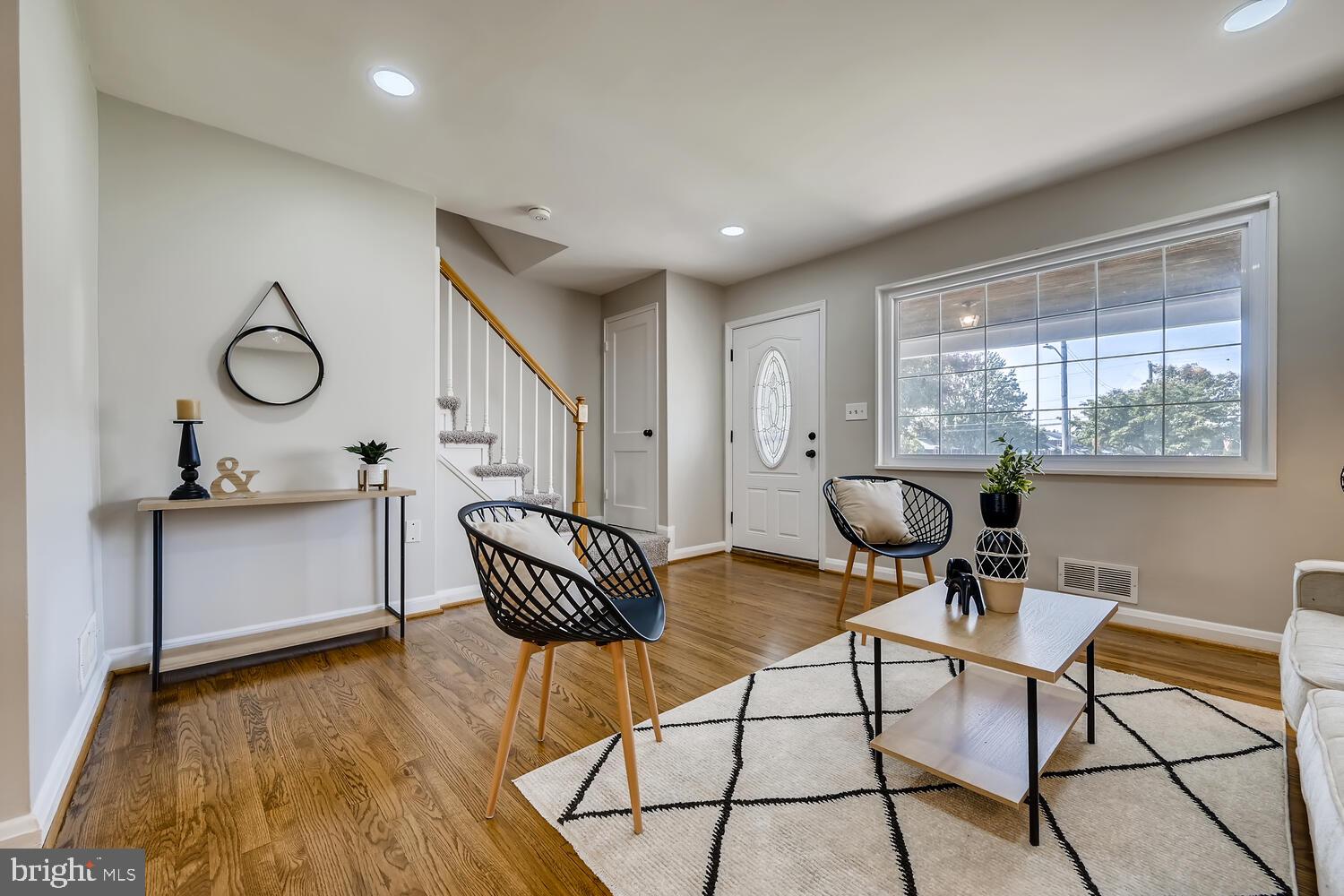 2720 Moorgate Road Baltimore, MD 21222 - Photo 6 of 28 a living room with furniture a window and a chandelier