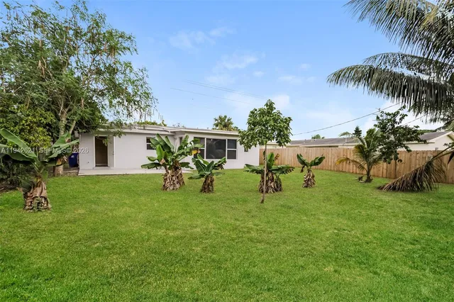 a view of a house with a yard porch and sitting area