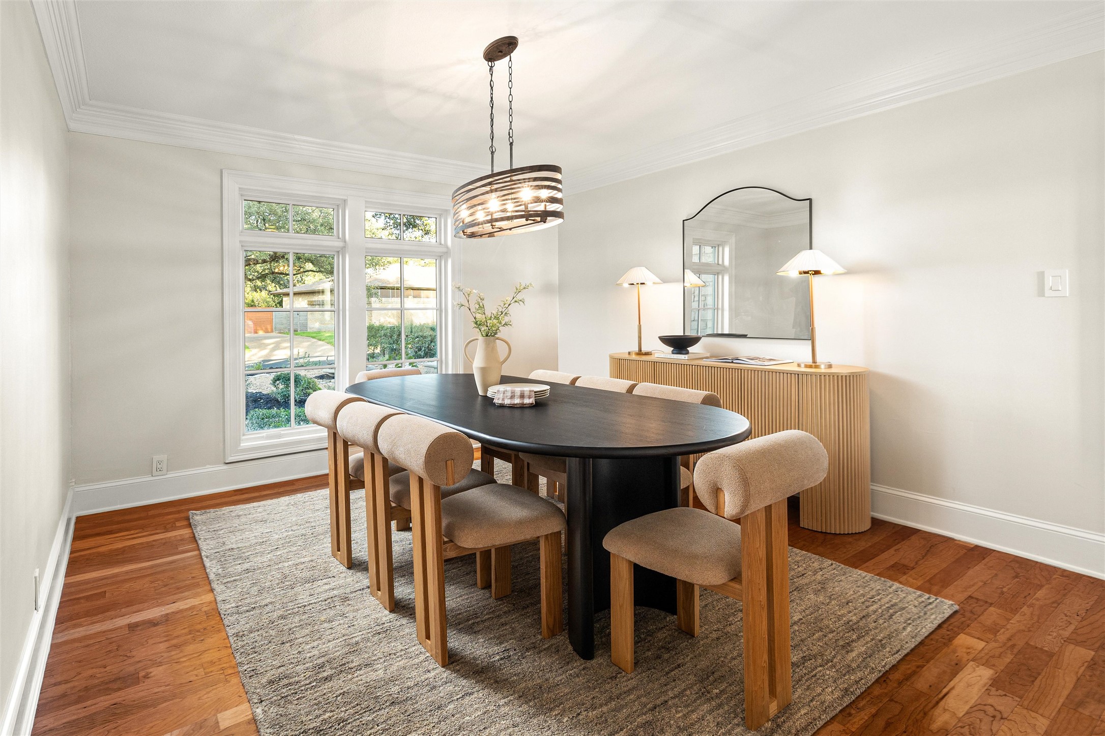 5301 Valburn Circle Austin, TX 78731 - Photo 11 of 39 a dining room with furniture a chandelier and wooden floor