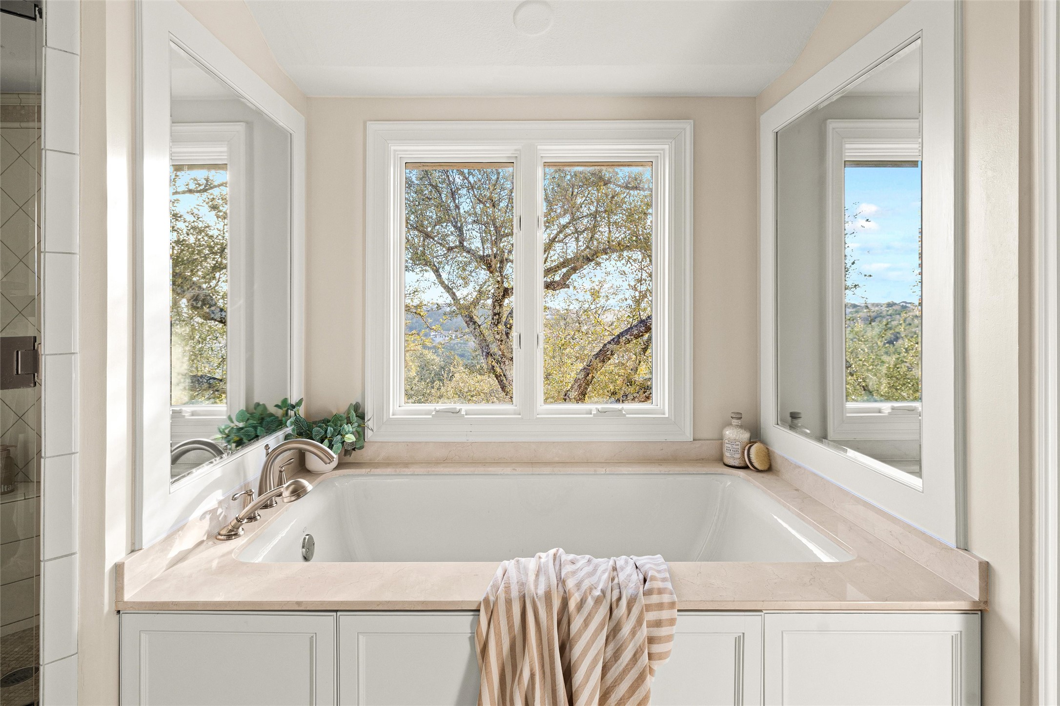 5301 Valburn Circle Austin, TX 78731 - Photo 20 of 39 a bath tub sitting in a bathroom next to a window