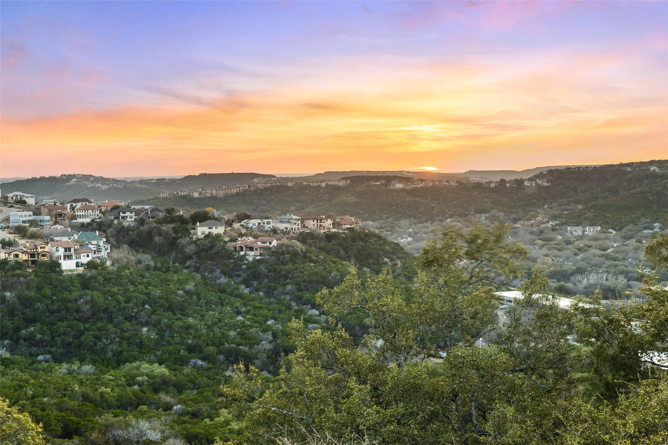 5301 Valburn Circle Austin, TX 78731 - Photo 2 of 39 a view of a mountain range in a cloudy sky