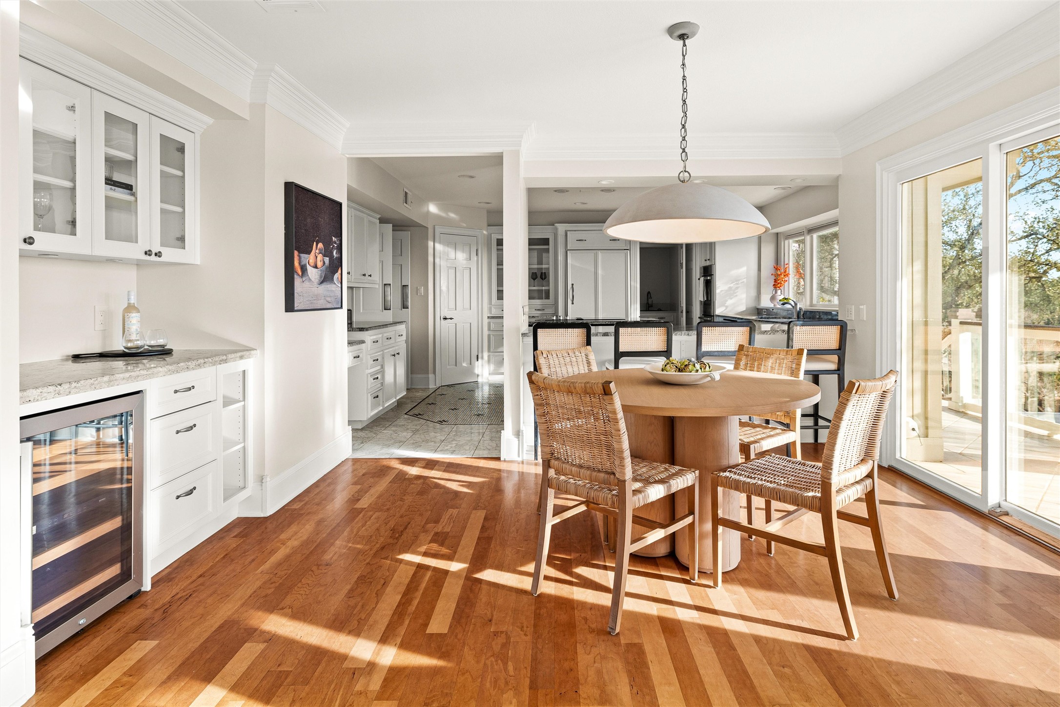 5301 Valburn Circle Austin, TX 78731 - Photo 7 of 39 a dining hall with stainless steel appliances kitchen island granite countertop a table chairs and a wooden floor