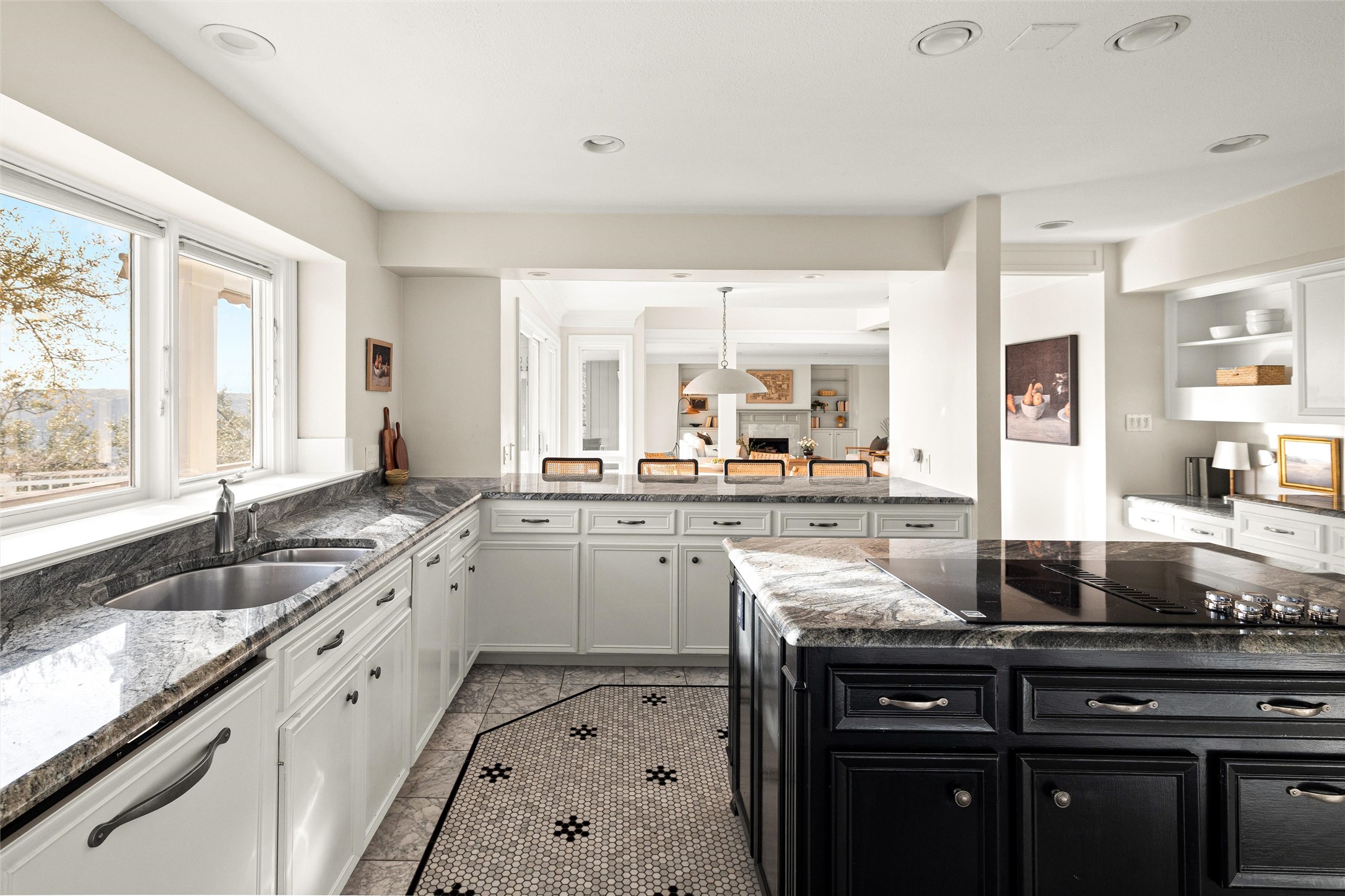 5301 Valburn Circle Austin, TX 78731 - Photo 10 of 39 a large kitchen with granite countertop a sink and cabinets