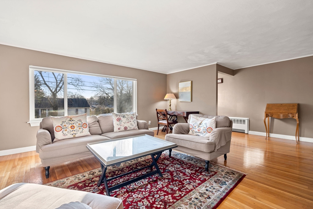 42 Stanley Road Newton, MA 02468 - Photo 11 of 29 a living room with furniture a rug wooden floor and a large window