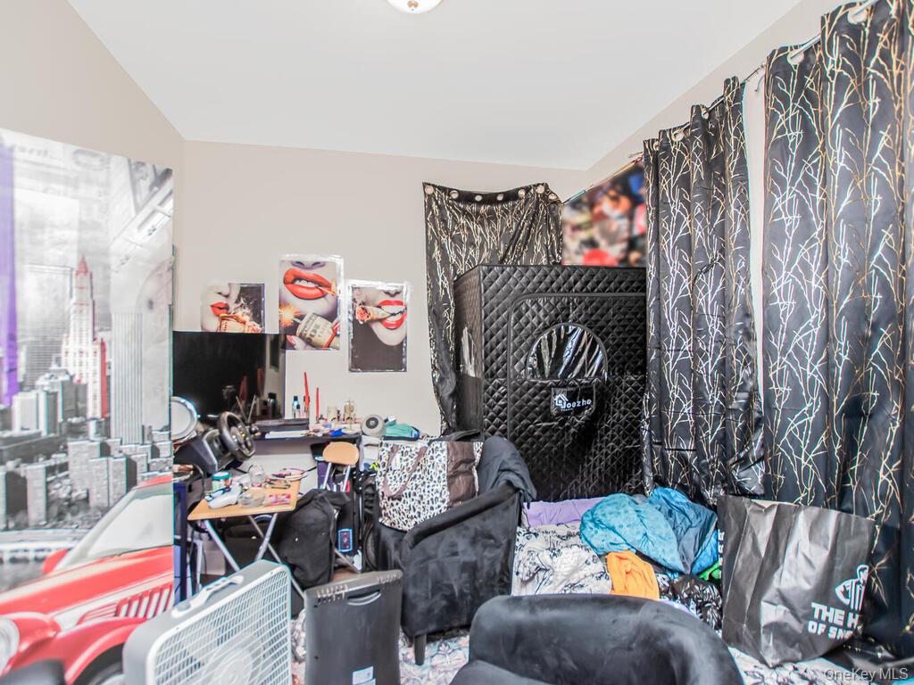 1406 White Plains Road Bronx, NY 10462 - Photo 12 of 43 a living room with furniture and a couch