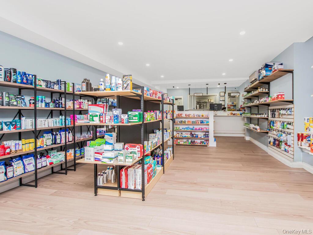1406 White Plains Road Bronx, NY 10462 - Photo 25 of 43 a room with furniture and a book shelf