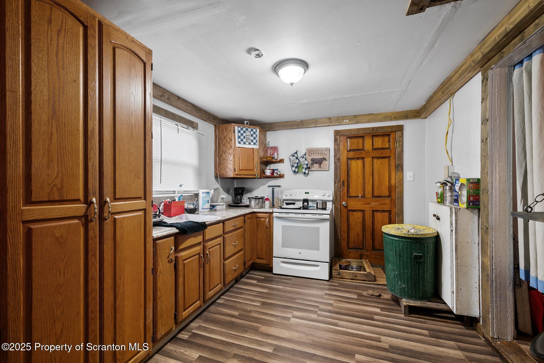 1024 South Webster Avenue Scranton, PA 18505 - Photo 11 of 38 a kitchen with a refrigerator and a stove top oven