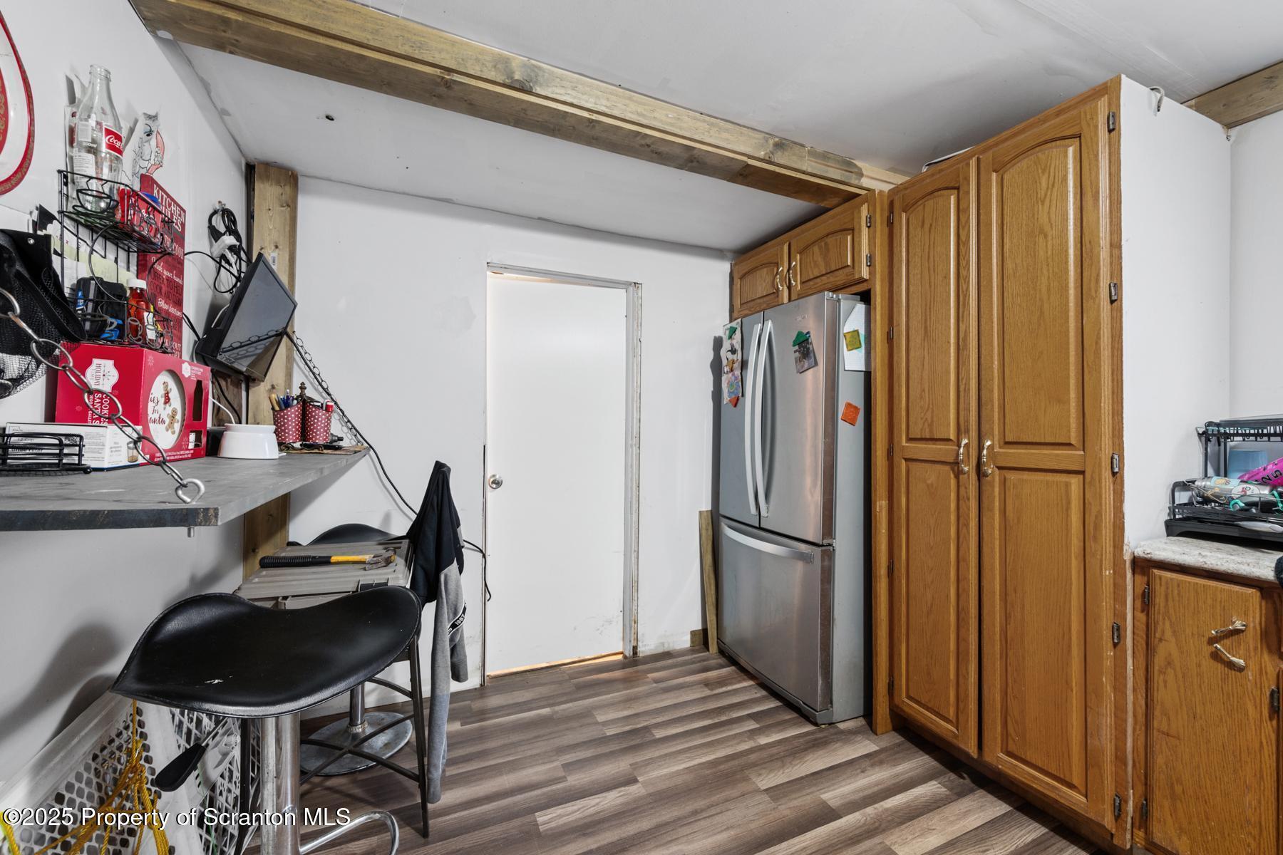 1024 South Webster Avenue Scranton, PA 18505 - Photo 12 of 38 a view of a kitchen with refrigerator and furniture