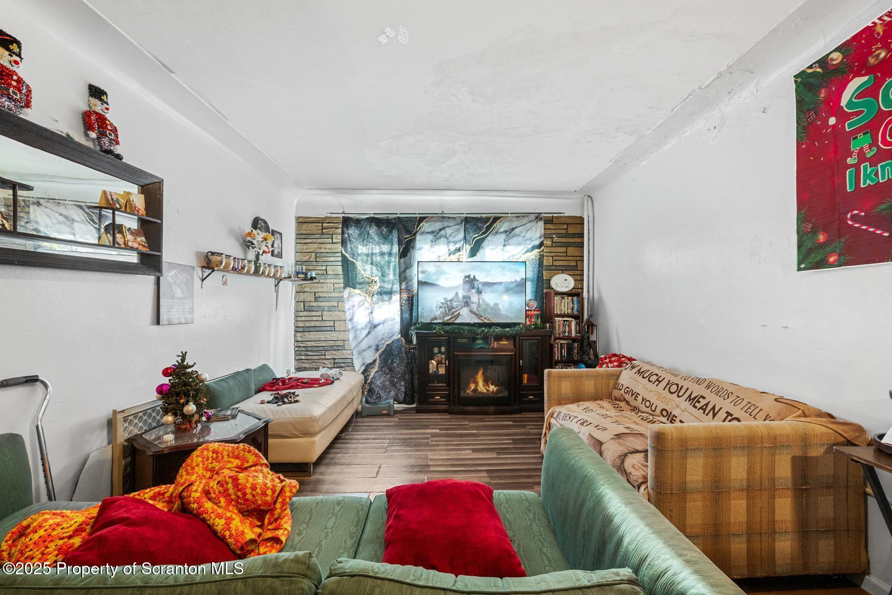 1024 South Webster Avenue Scranton, PA 18505 - Photo 13 of 38 a living room with furniture and a floor to ceiling window