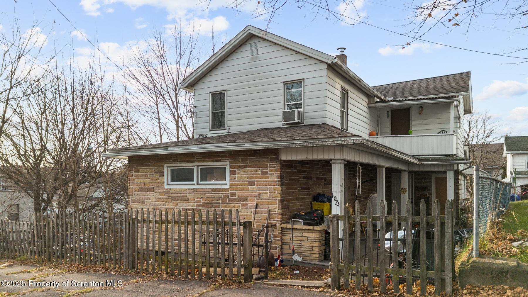 1024 South Webster Avenue Scranton, PA 18505 - Photo 2 of 38 a front view of a house with parking