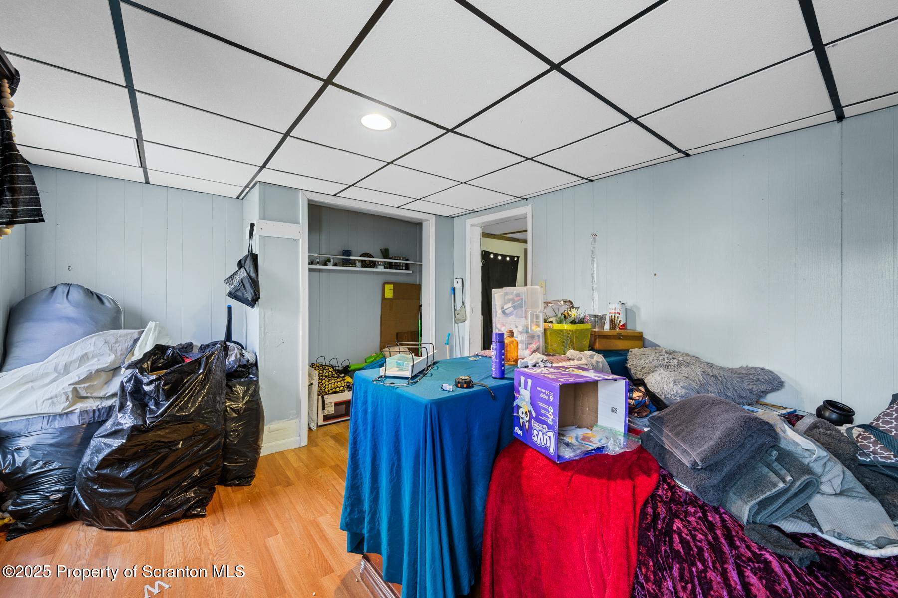 1024 South Webster Avenue Scranton, PA 18505 - Photo 24 of 38 a view of a room that has a bed gym equipment and wooden floor