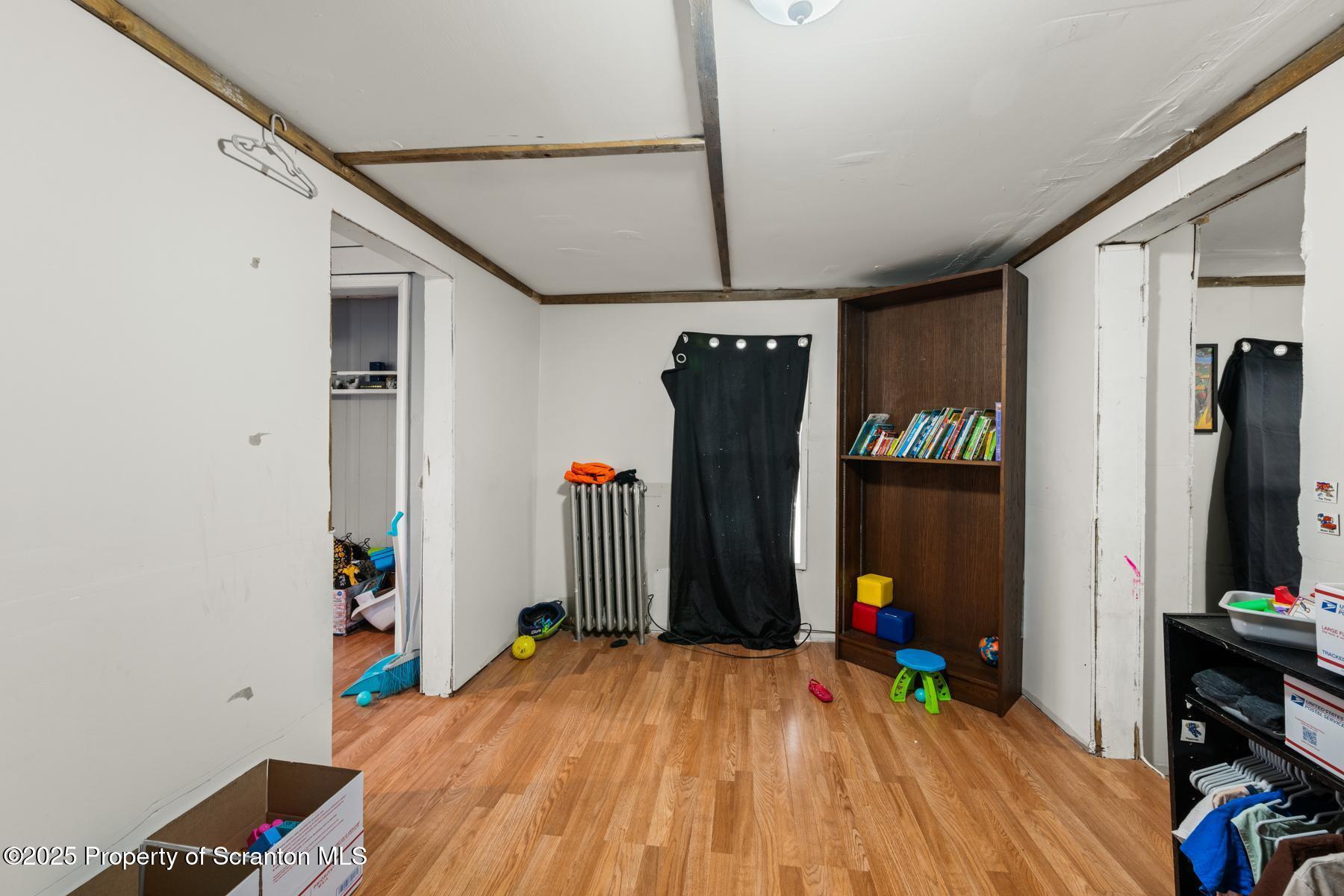 1024 South Webster Avenue Scranton, PA 18505 - Photo 26 of 38 a bedroom with a bed closet and a flat tv screen