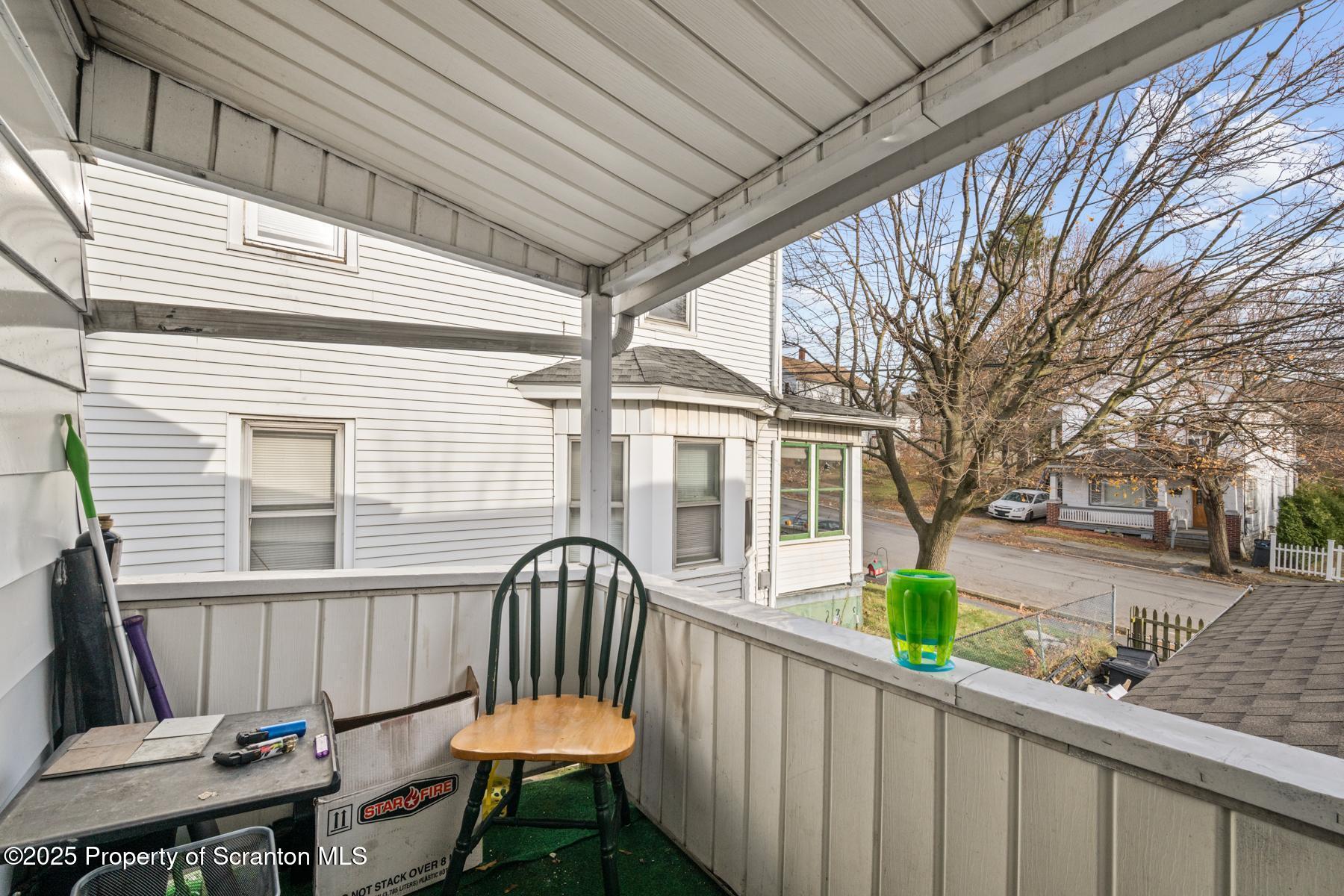1024 South Webster Avenue Scranton, PA 18505 - Photo 29 of 38 a view of a chair and table in the balcony