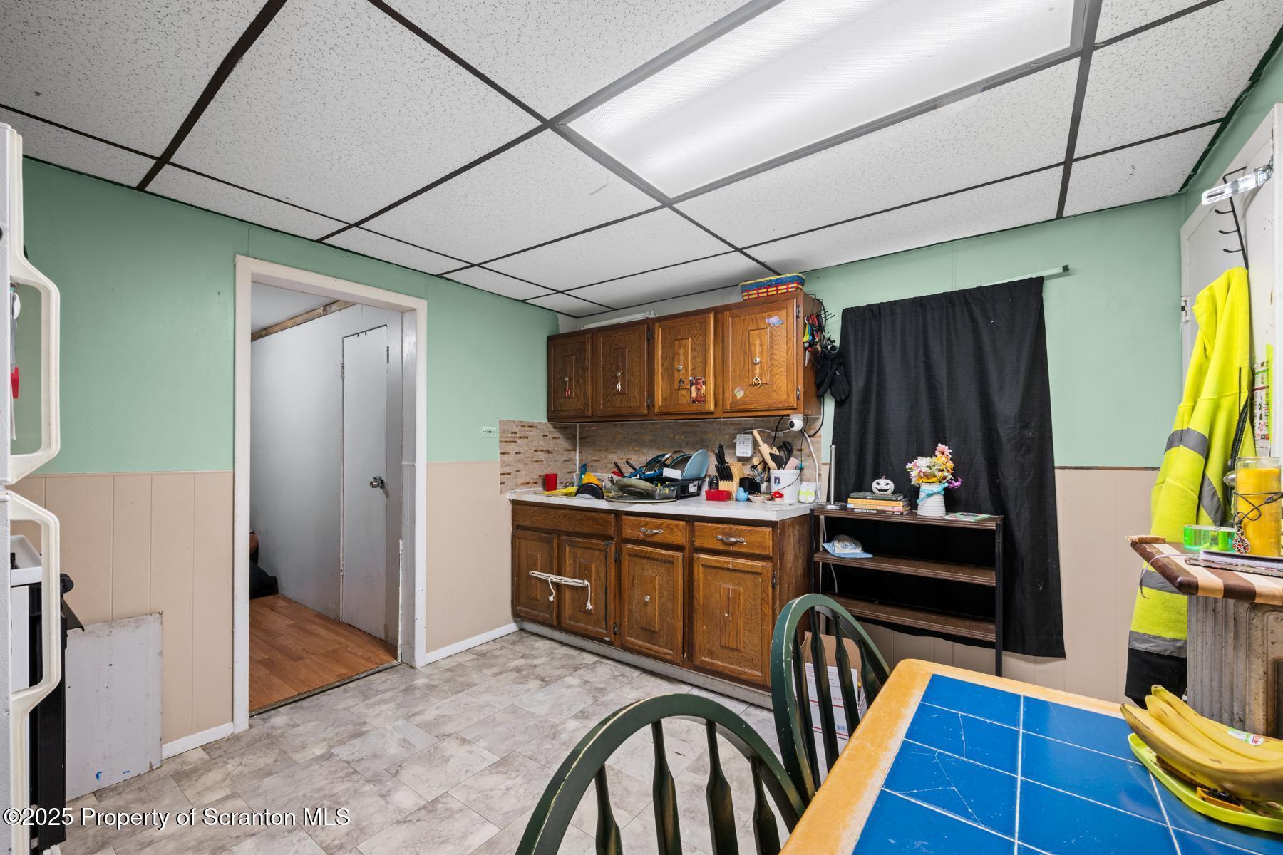 1024 South Webster Avenue Scranton, PA 18505 - Photo 30 of 38 a kitchen with stainless steel appliances granite countertop a refrigerator and a stove top oven