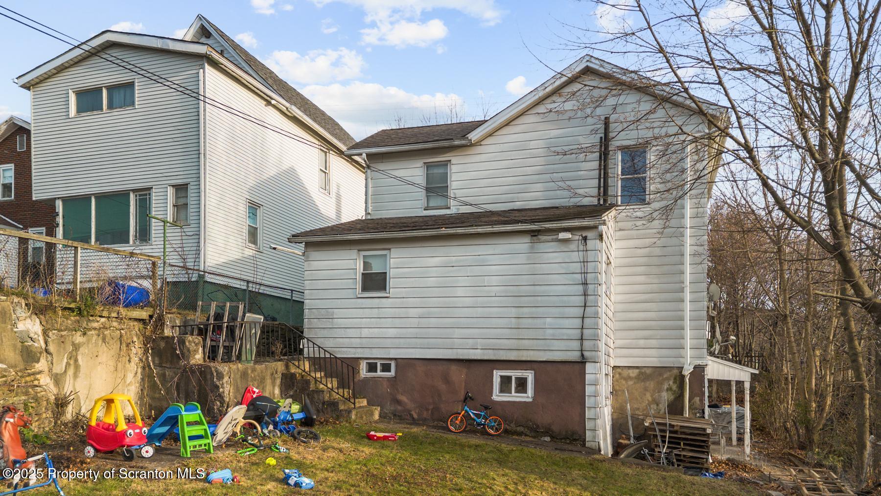 1024 South Webster Avenue Scranton, PA 18505 - Photo 4 of 38 a view of a house with a yard