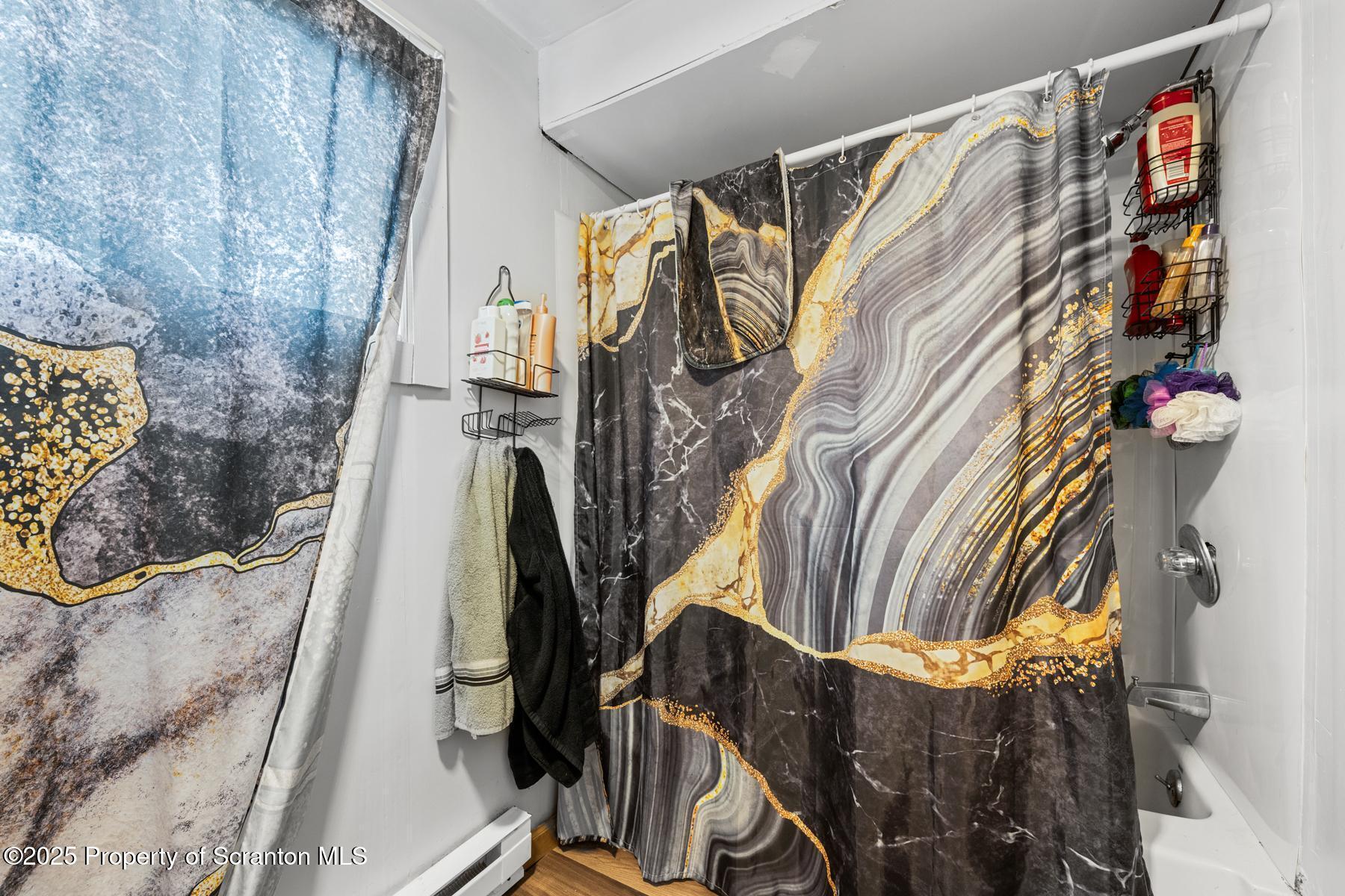 1024 South Webster Avenue Scranton, PA 18505 - Photo 9 of 38 a view of walk in closet with clothes