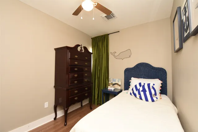 a white toilet sitting next to a shower curtain