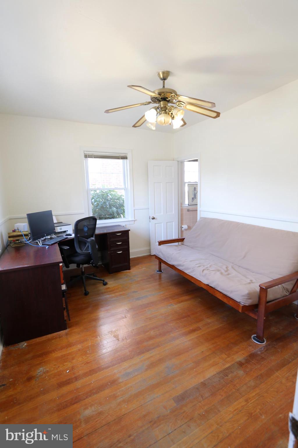 2038 34th Street Southeast Washington, DC 20020 - Photo 16 of 32 a living room with furniture and a ceiling fan