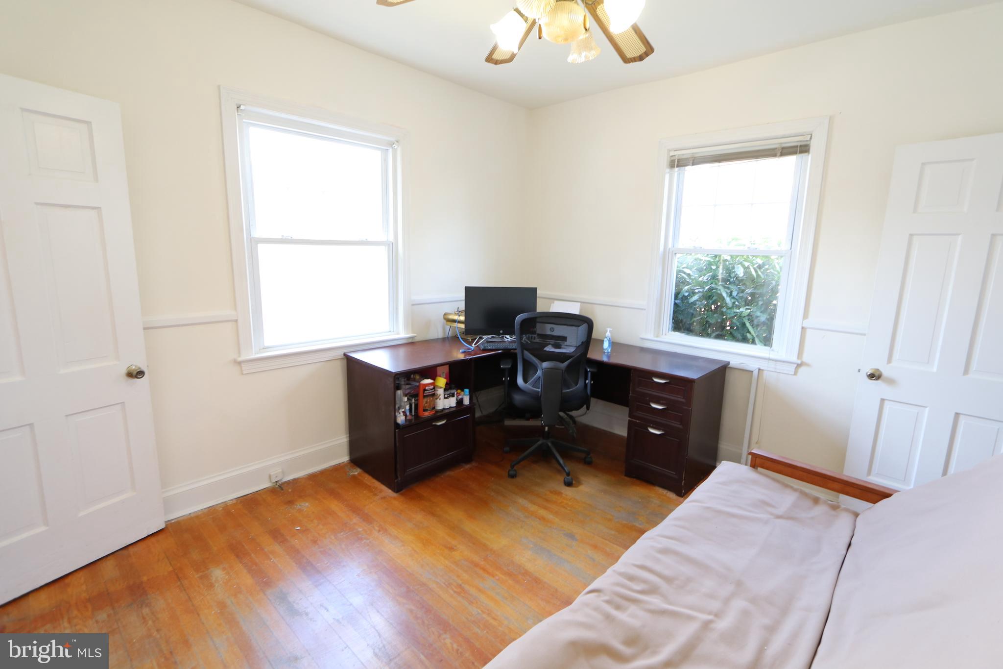 2038 34th Street Southeast Washington, DC 20020 - Photo 17 of 32 a bedroom with a bed and a window