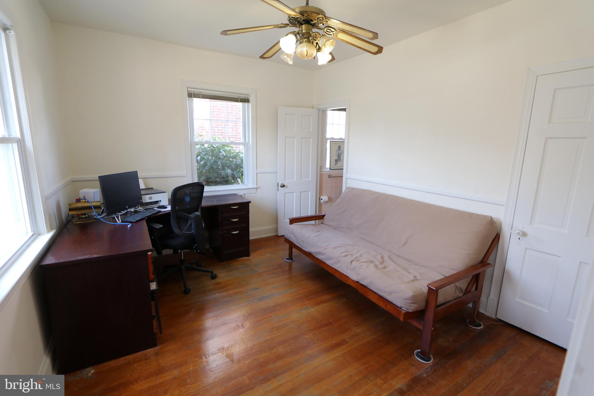2038 34th Street Southeast Washington, DC 20020 - Photo 18 of 32 a bedroom with furniture and a window