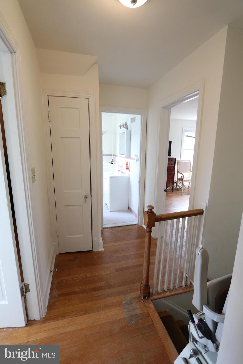 2038 34th Street Southeast Washington, DC 20020 - Photo 21 of 32 a view of a hallway with wooden floor and stairs
