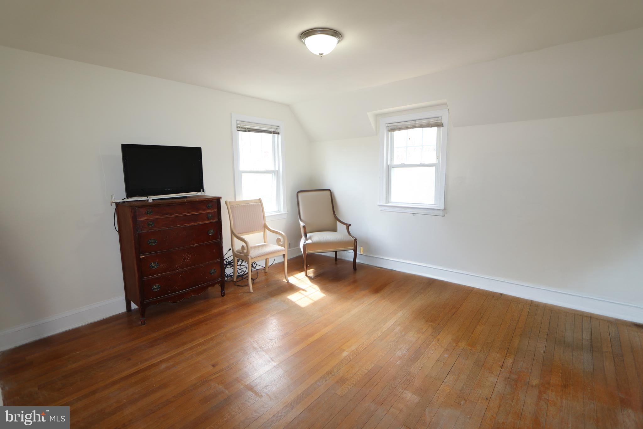 2038 34th Street Southeast Washington, DC 20020 - Photo 22 of 32 a living room with furniture and a flat screen tv