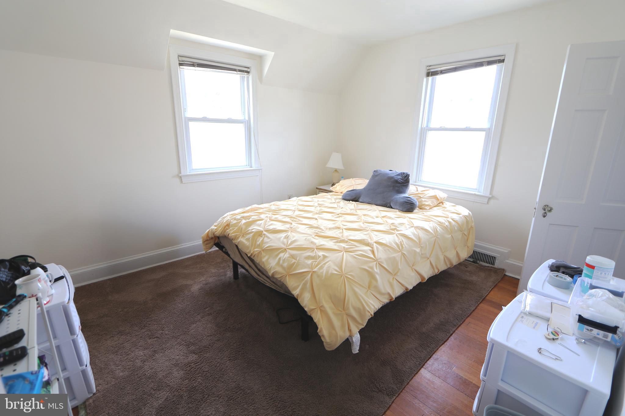 2038 34th Street Southeast Washington, DC 20020 - Photo 25 of 32 a bedroom with a bed and a window