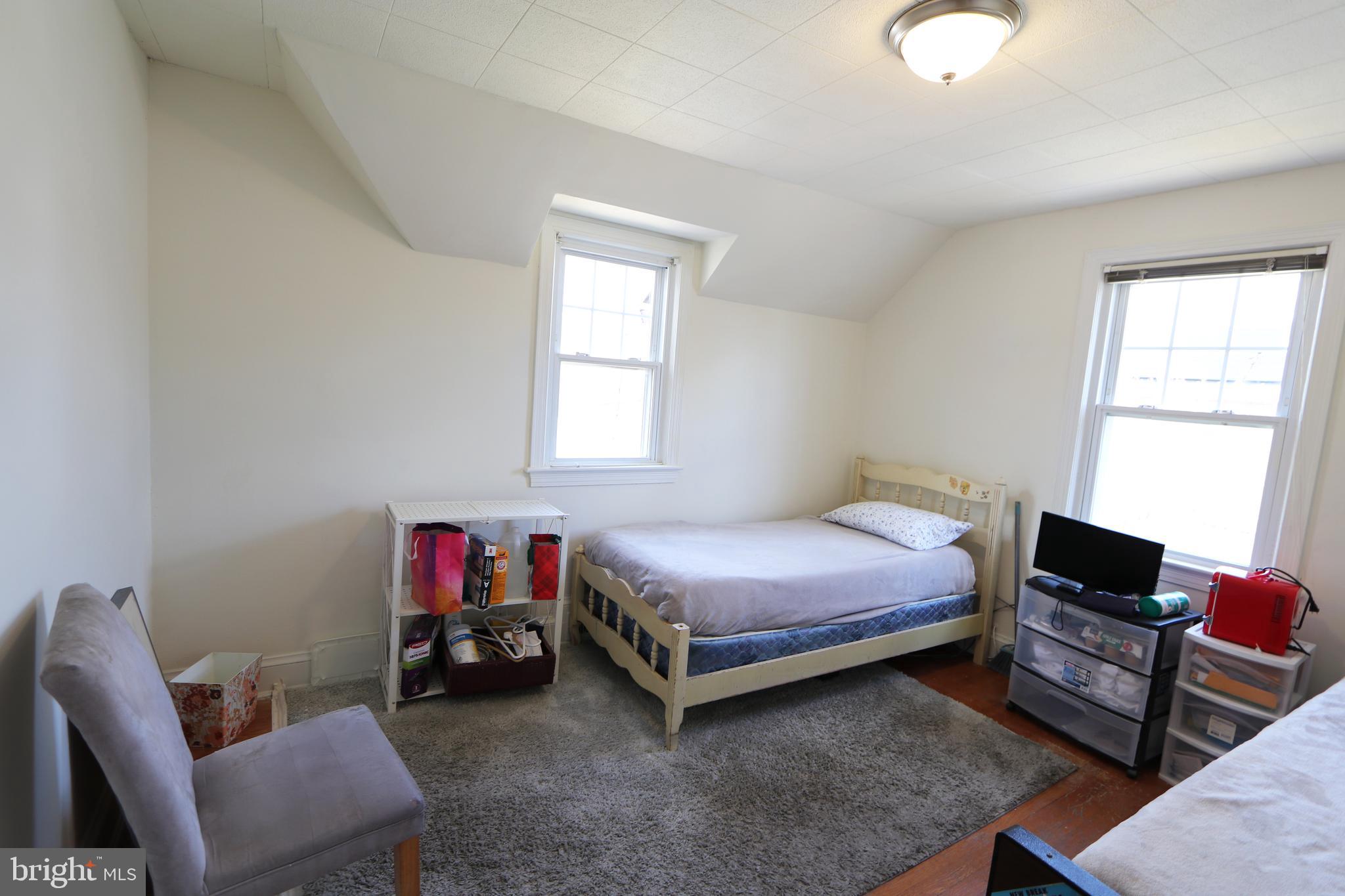 2038 34th Street Southeast Washington, DC 20020 - Photo 27 of 32 a bedroom with a bed and a window