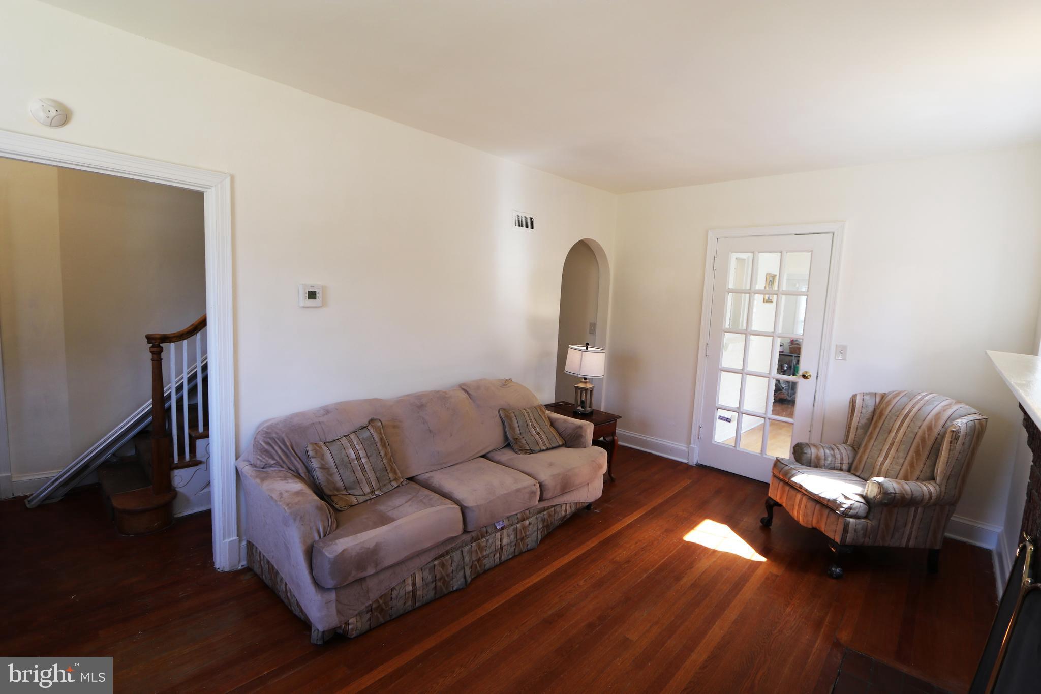 2038 34th Street Southeast Washington, DC 20020 - Photo 4 of 32 a living room with furniture and a wooden floor