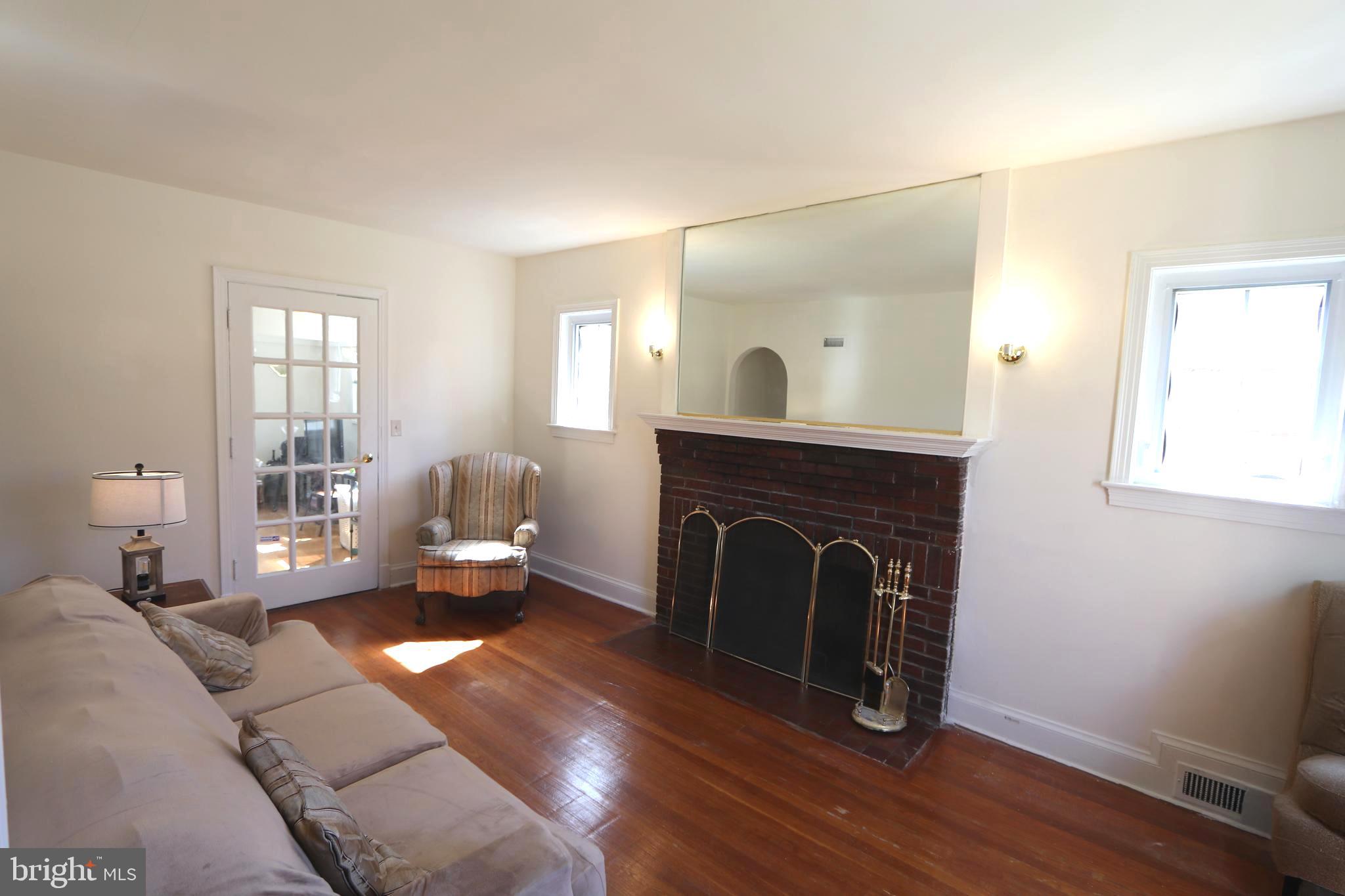 2038 34th Street Southeast Washington, DC 20020 - Photo 5 of 32 a living room with furniture and a fireplace