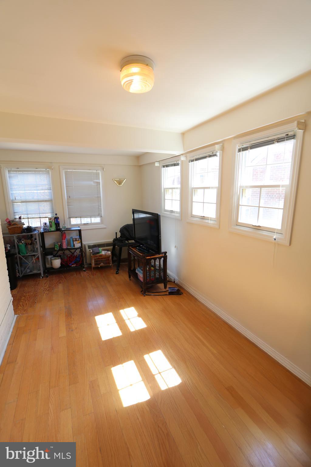 2038 34th Street Southeast Washington, DC 20020 - Photo 6 of 32 a living room with furniture and a flat screen tv