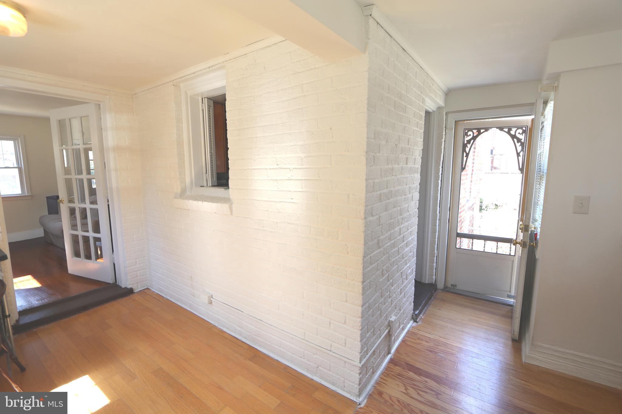 2038 34th Street Southeast Washington, DC 20020 - Photo 7 of 32 a view of hallway with wooden floor and window