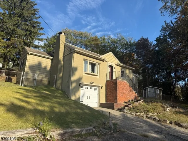a view of a yard in front of a house